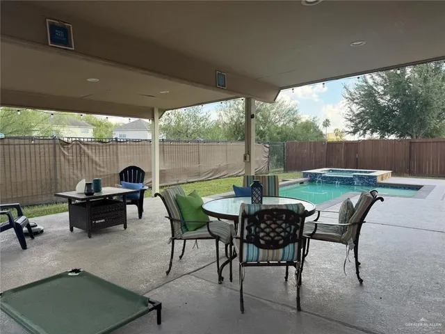 a view of an outdoor sitting area with furniture and garden