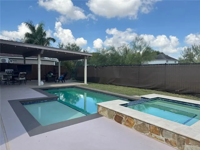 a view of a backyard with sitting area