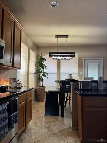 a kitchen with a table and chairs in it