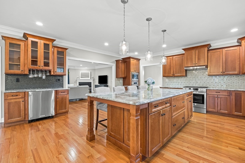 15 Maryvale Road Burlington, MA 01803 - Photo 13 of 42 a kitchen with stainless steel appliances granite countertop a sink a stove top oven a counter space and cabinets