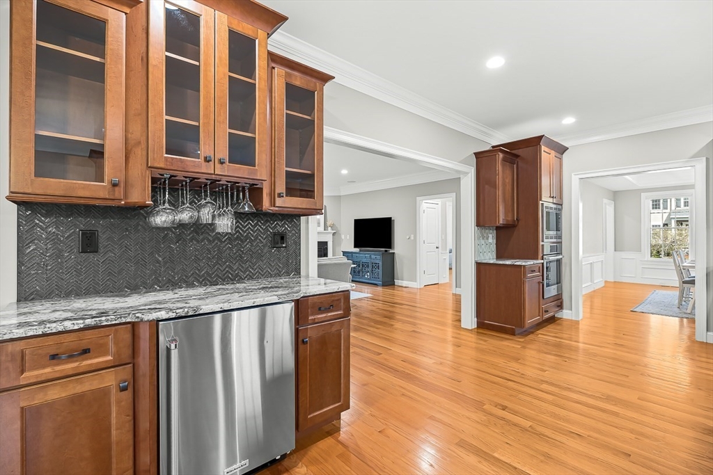 15 Maryvale Road Burlington, MA 01803 - Photo 15 of 42 a large kitchen with stainless steel appliances granite countertop a refrigerator and wooden cabinets