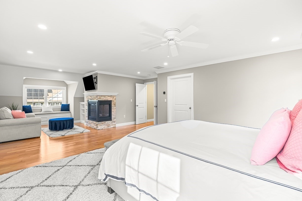 15 Maryvale Road Burlington, MA 01803 - Photo 22 of 42 a spacious bedroom with a bed and a fireplace