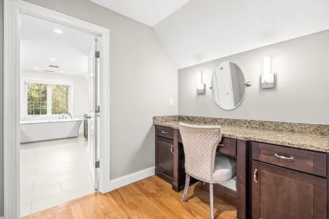 a view of a chair and table in a room