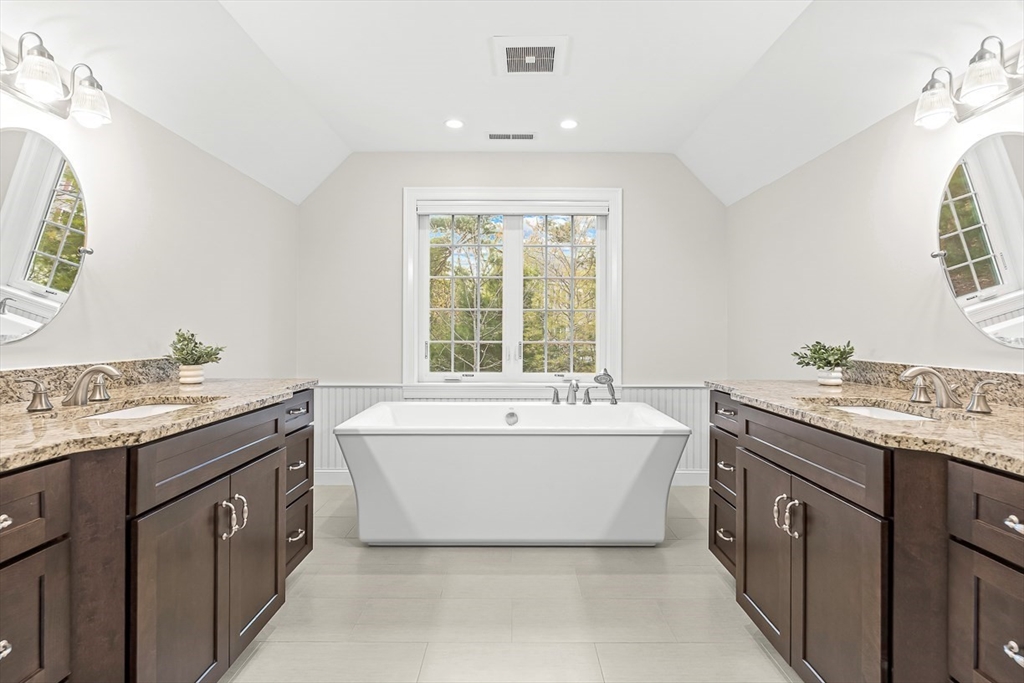 15 Maryvale Road Burlington, MA 01803 - Photo 26 of 42 a spacious bathroom with a granite countertop sink and a bathtub