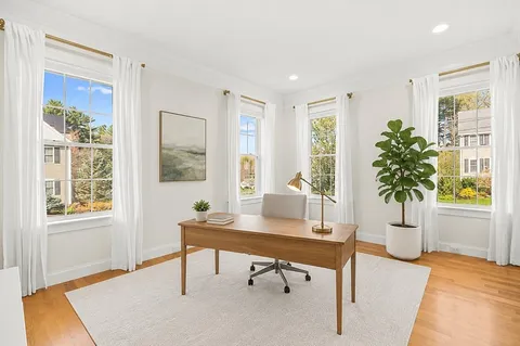 a workspace with furniture and window