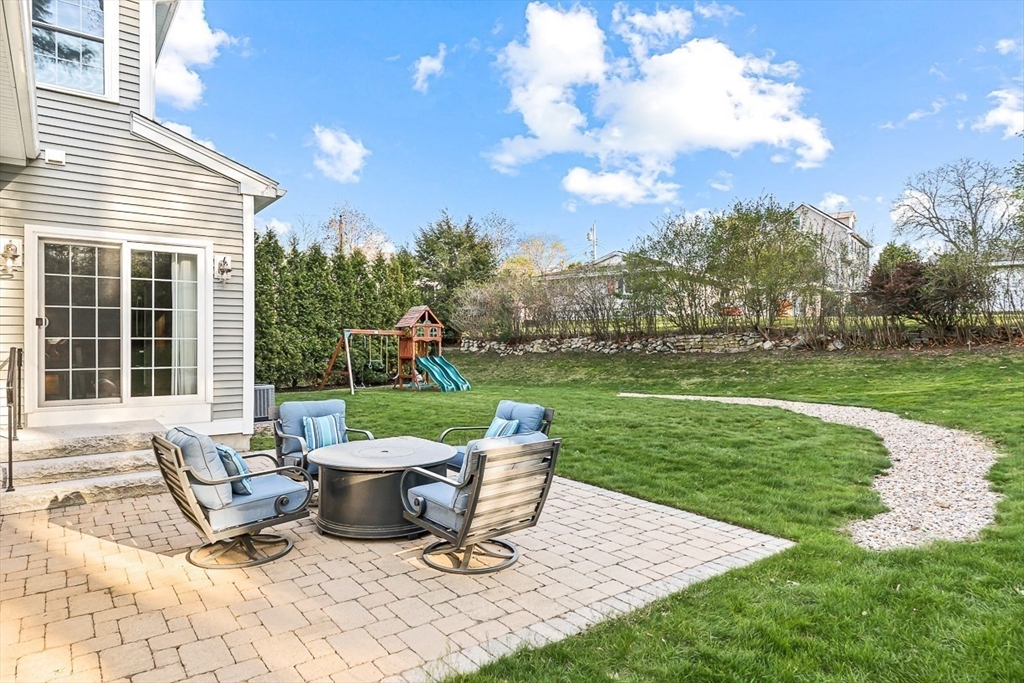 15 Maryvale Road Burlington, MA 01803 - Photo 37 of 42 a view of a patio with a table chairs and a yard
