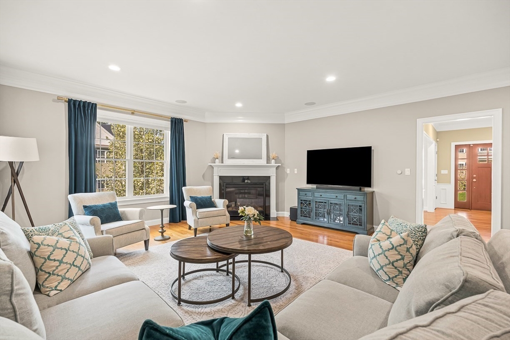 15 Maryvale Road Burlington, MA 01803 - Photo 5 of 42 a living room with furniture a flat screen tv and a large window
