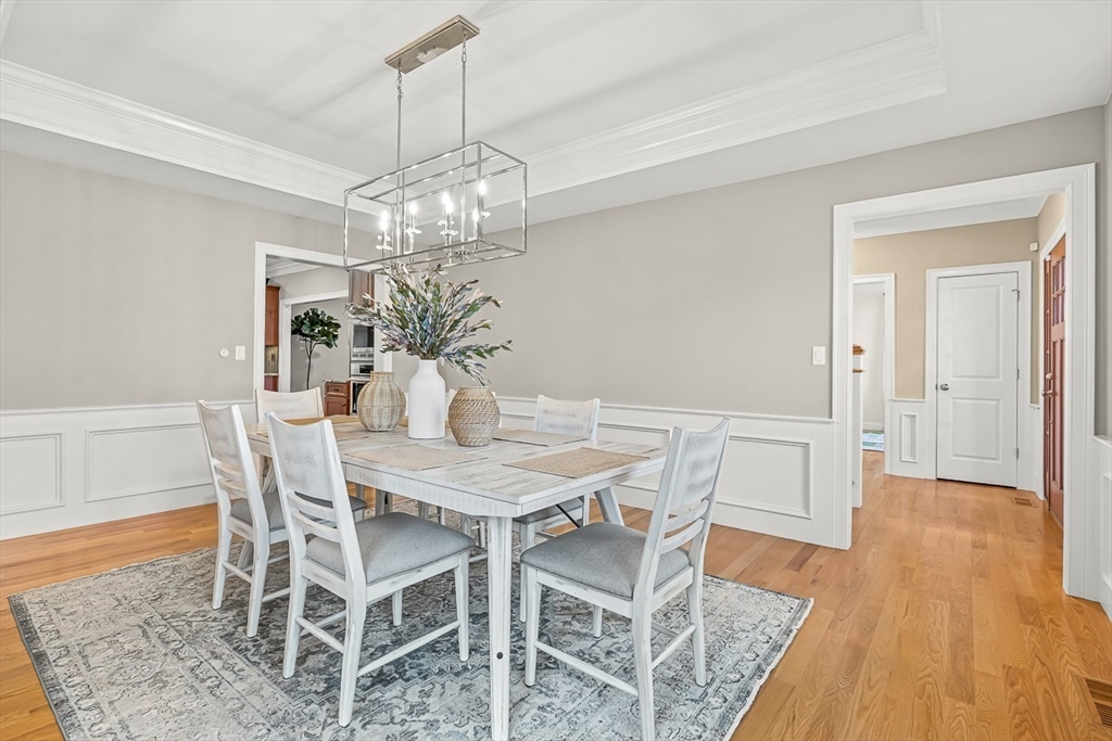15 Maryvale Road Burlington, MA 01803 - Photo 9 of 42 a view of a dining room with furniture wooden floor and chandelier