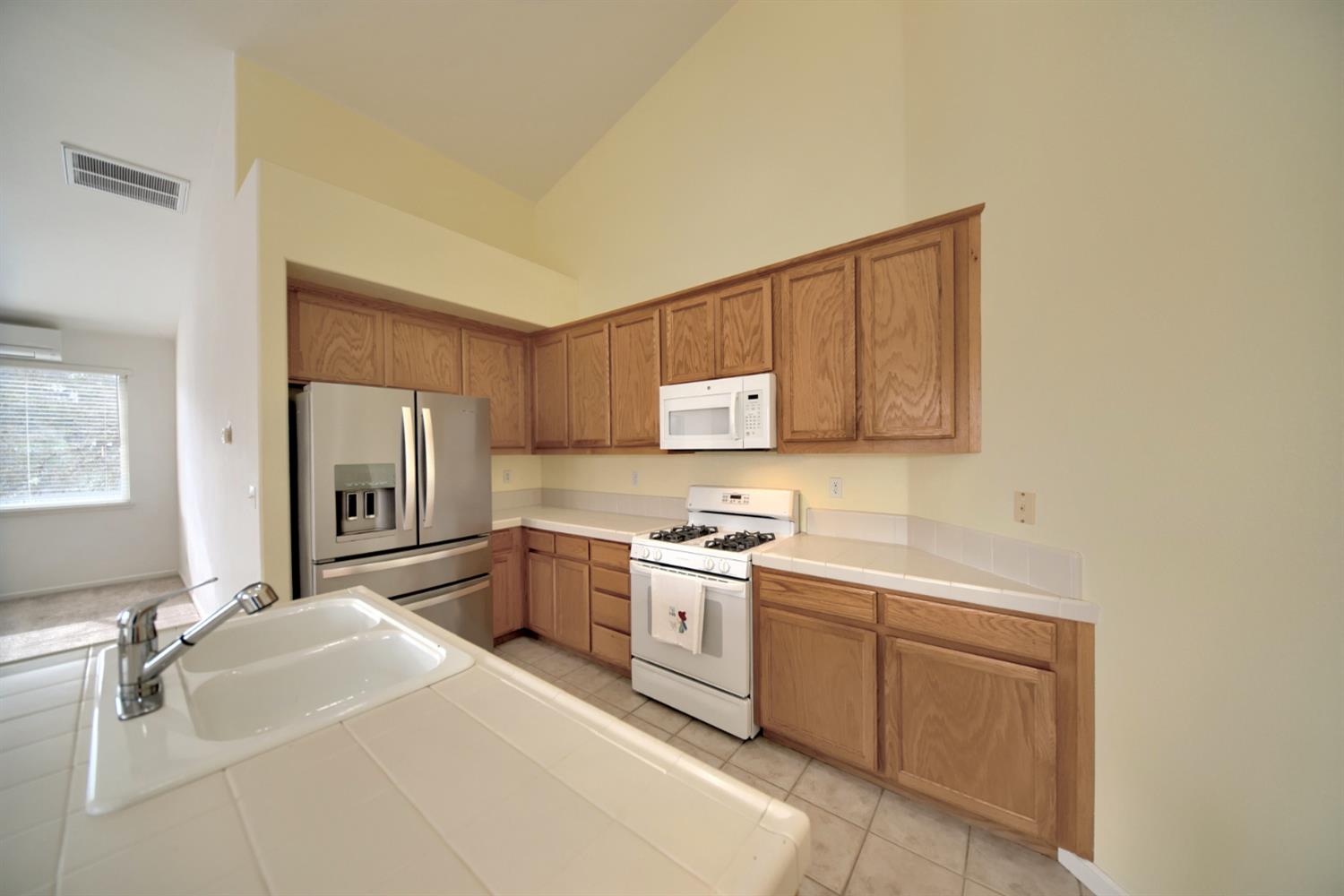 6250 Bluff View Road Copperopolis, CA 95228 - Photo 12 of 76 a kitchen with a sink appliances and cabinets
