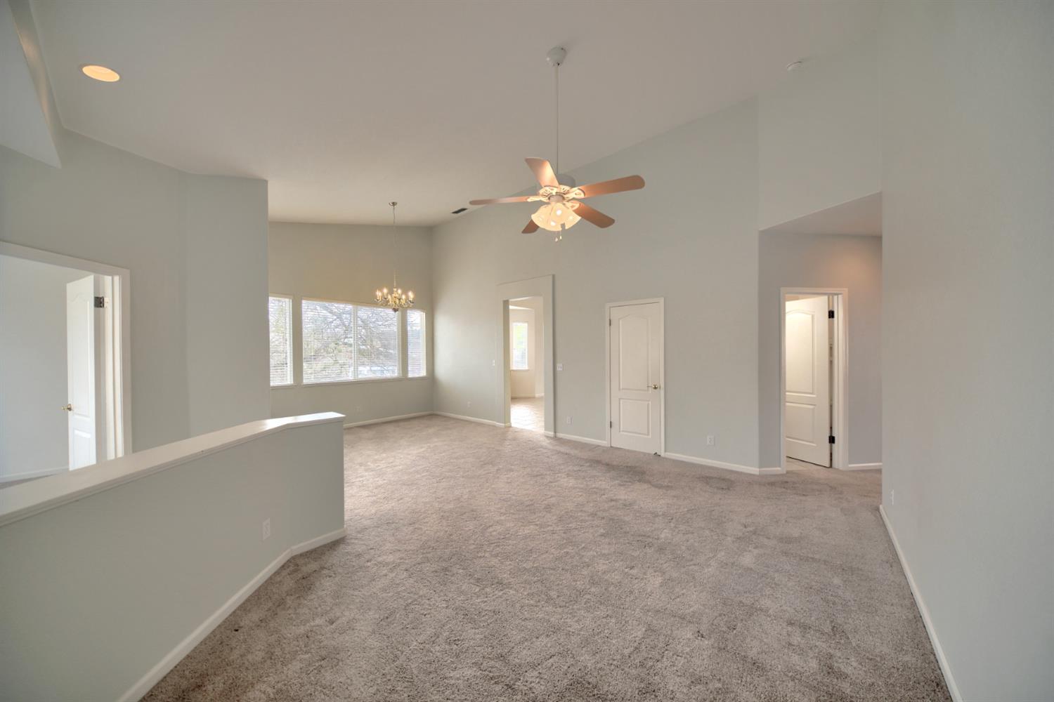 6250 Bluff View Road Copperopolis, CA 95228 - Photo 22 of 76 an empty room with windows and fan