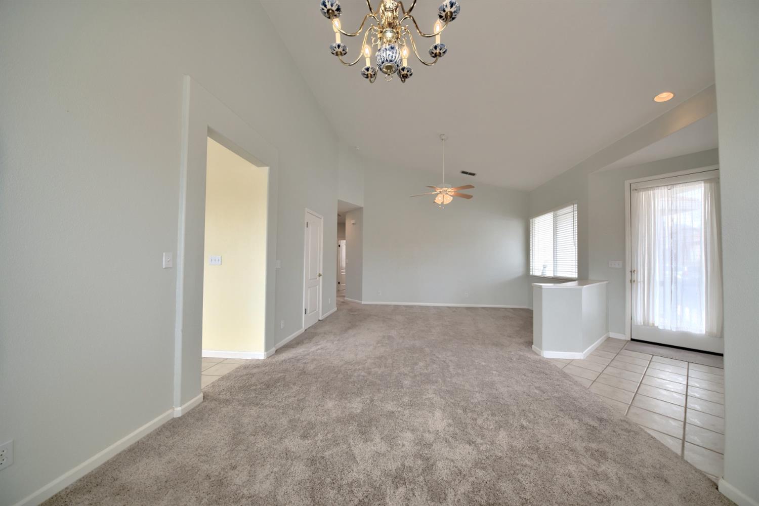 6250 Bluff View Road Copperopolis, CA 95228 - Photo 28 of 76 a view of a big room with windows and chandelier