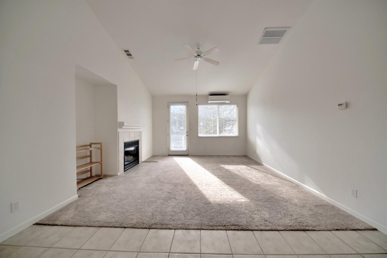 6250 Bluff View Road Copperopolis, CA 95228 - Photo 35 of 76 an empty room with fireplace and windows
