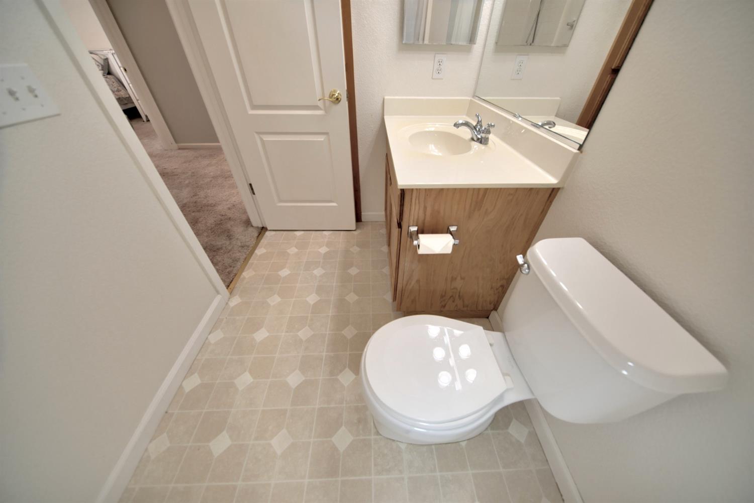 6250 Bluff View Road Copperopolis, CA 95228 - Photo 42 of 76 a bathroom with a sink and mirror