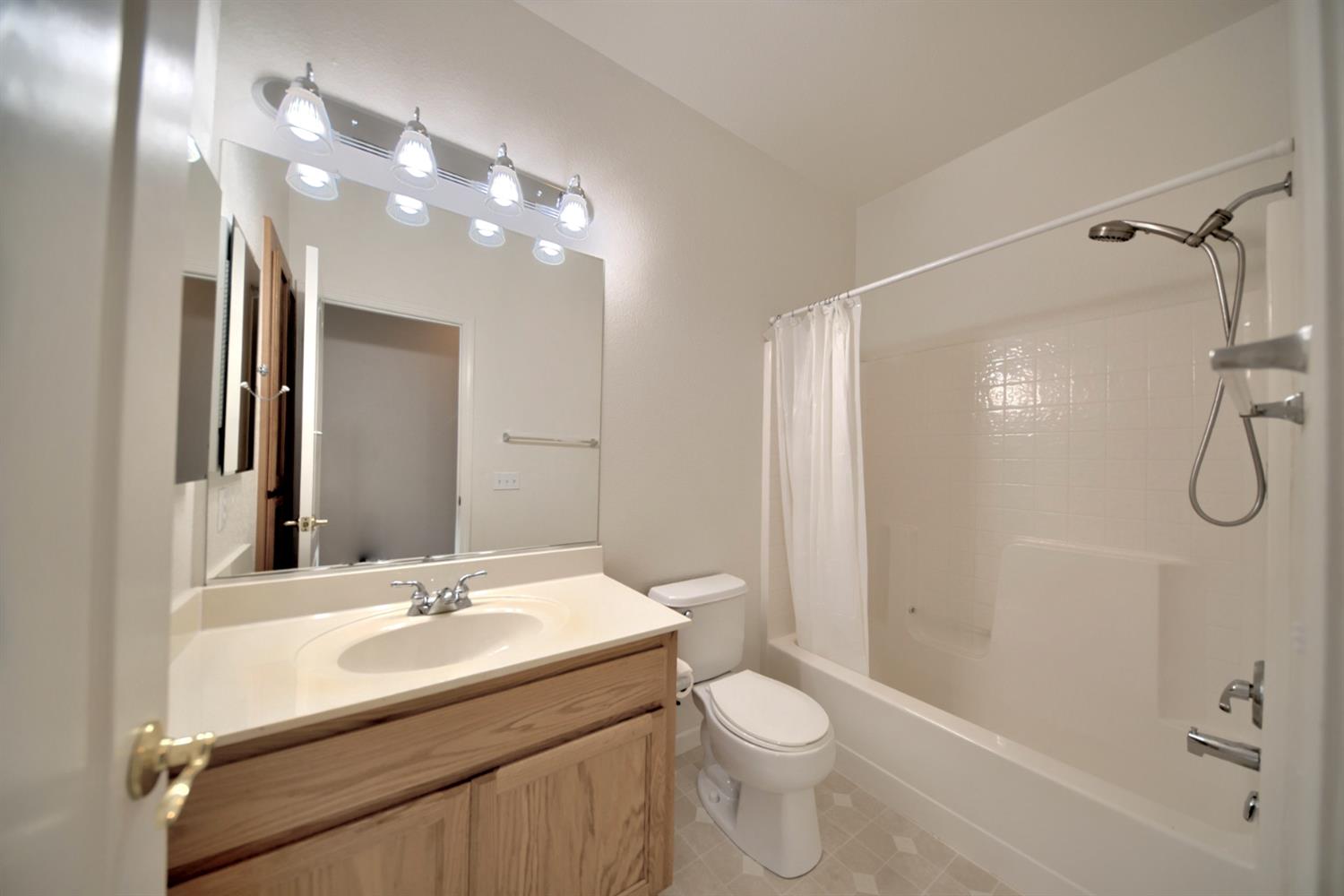 6250 Bluff View Road Copperopolis, CA 95228 - Photo 43 of 76 a bathroom with a sink a toilet and shower