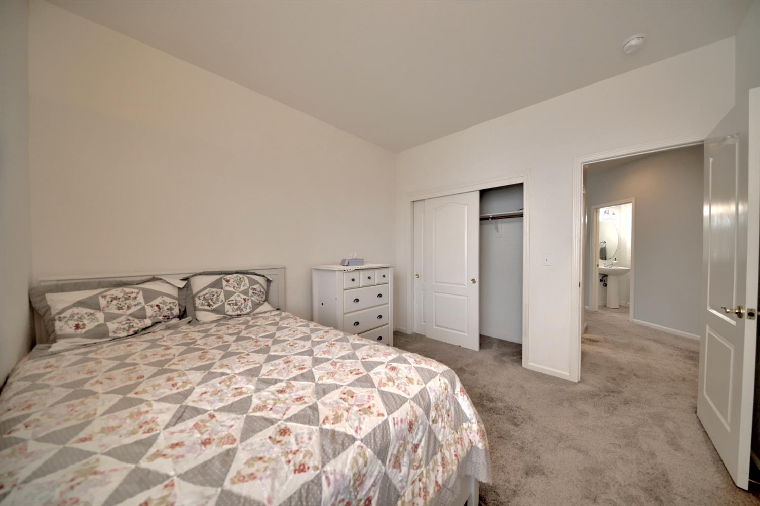 6250 Bluff View Road Copperopolis, CA 95228 - Photo 49 of 76 a bedroom with a bed and a mirror