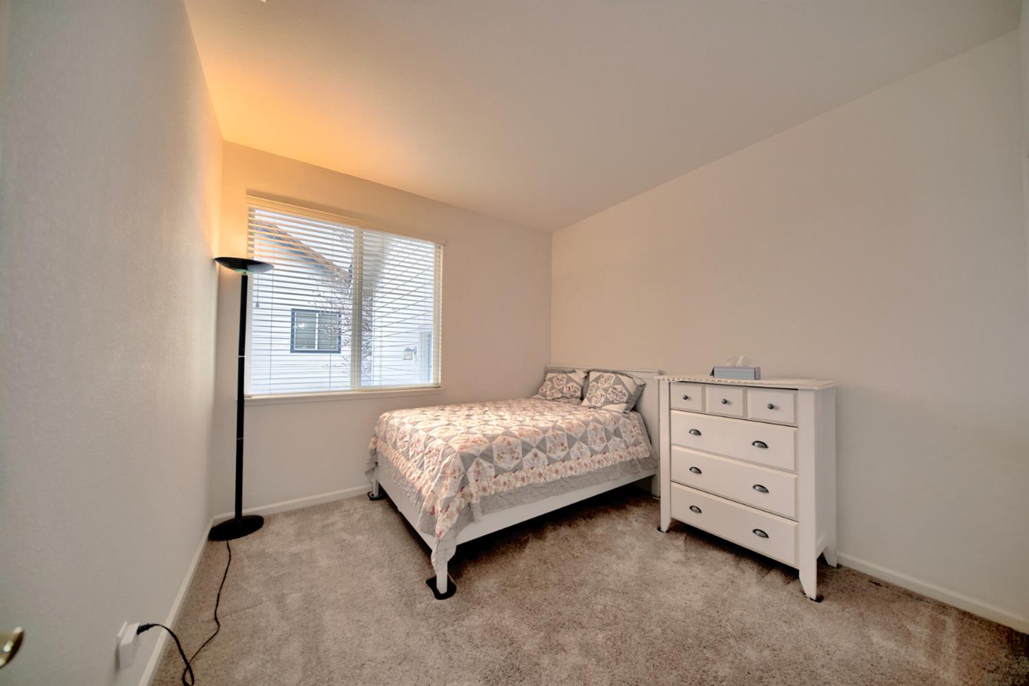 6250 Bluff View Road Copperopolis, CA 95228 - Photo 50 of 76 a bedroom with a bed and a dresser