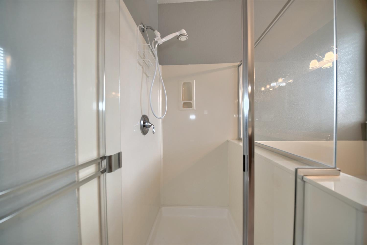 6250 Bluff View Road Copperopolis, CA 95228 - Photo 56 of 76 a bathroom with a shower and a glass door
