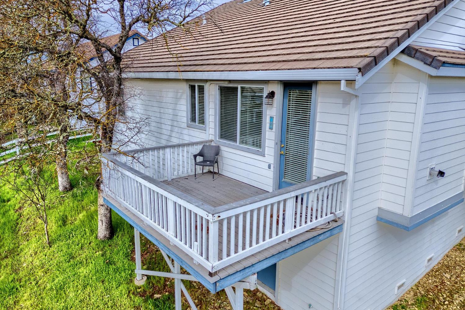 6250 Bluff View Road Copperopolis, CA 95228 - Photo 66 of 76 a view of a house with wooden deck and furniture