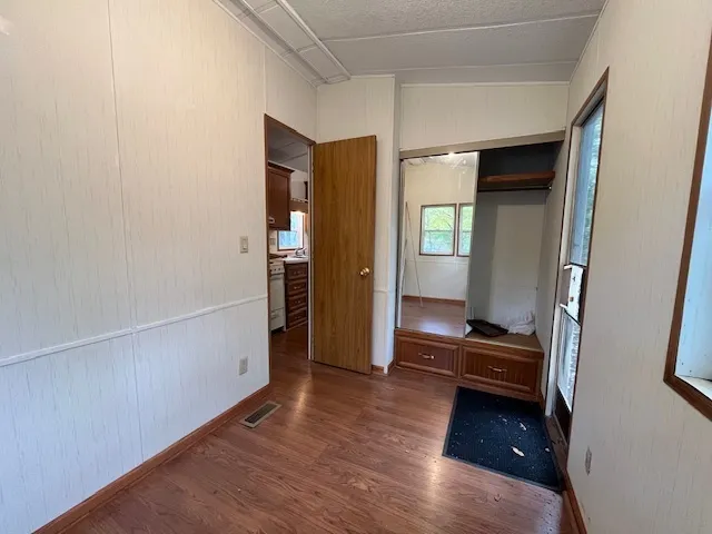 a white toilet sitting next to a bathroom sink and tub