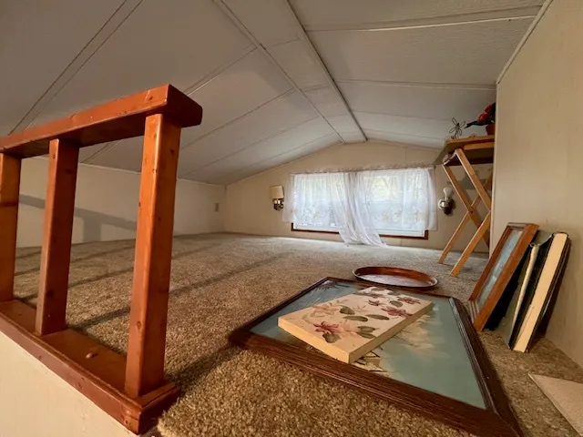 a view of backyard with wooden fence and a trees