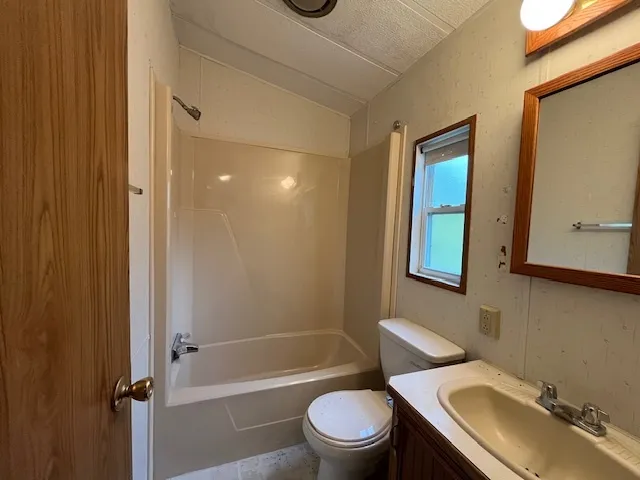 a view of a wooden deck next to a yard