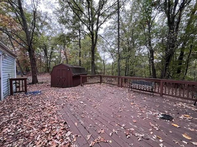 a view of a backyard with furniture and trees