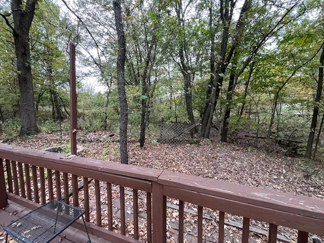 a view of a wooden deck with a trees