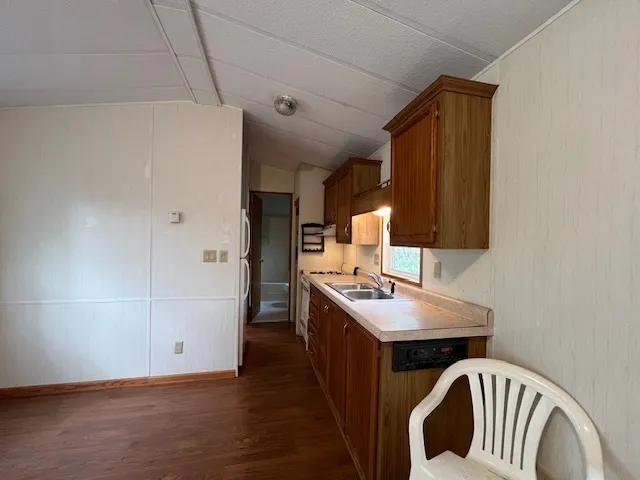 a kitchen with a stove and a refrigerator