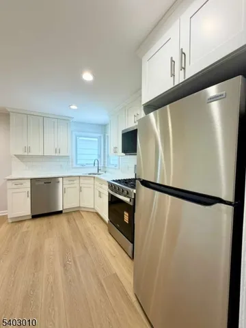 a white refrigerator freezer sitting inside of a kitchen