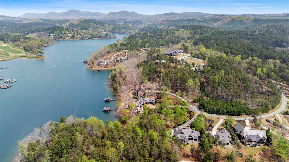195 Village View Drive Sunset, SC 29685 - Photo 47 of 48 This elevated view captures a serene lake community nestled among lush hills and mountains.