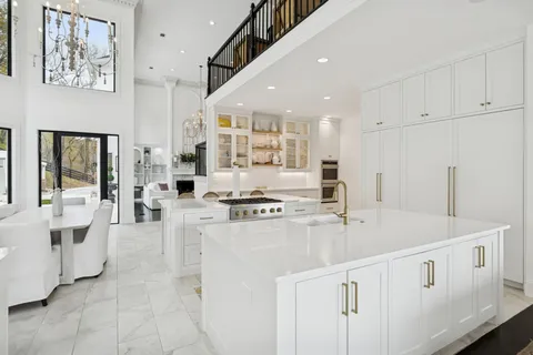 a bathroom with a double vanity sink a mirror a bathtub and shower