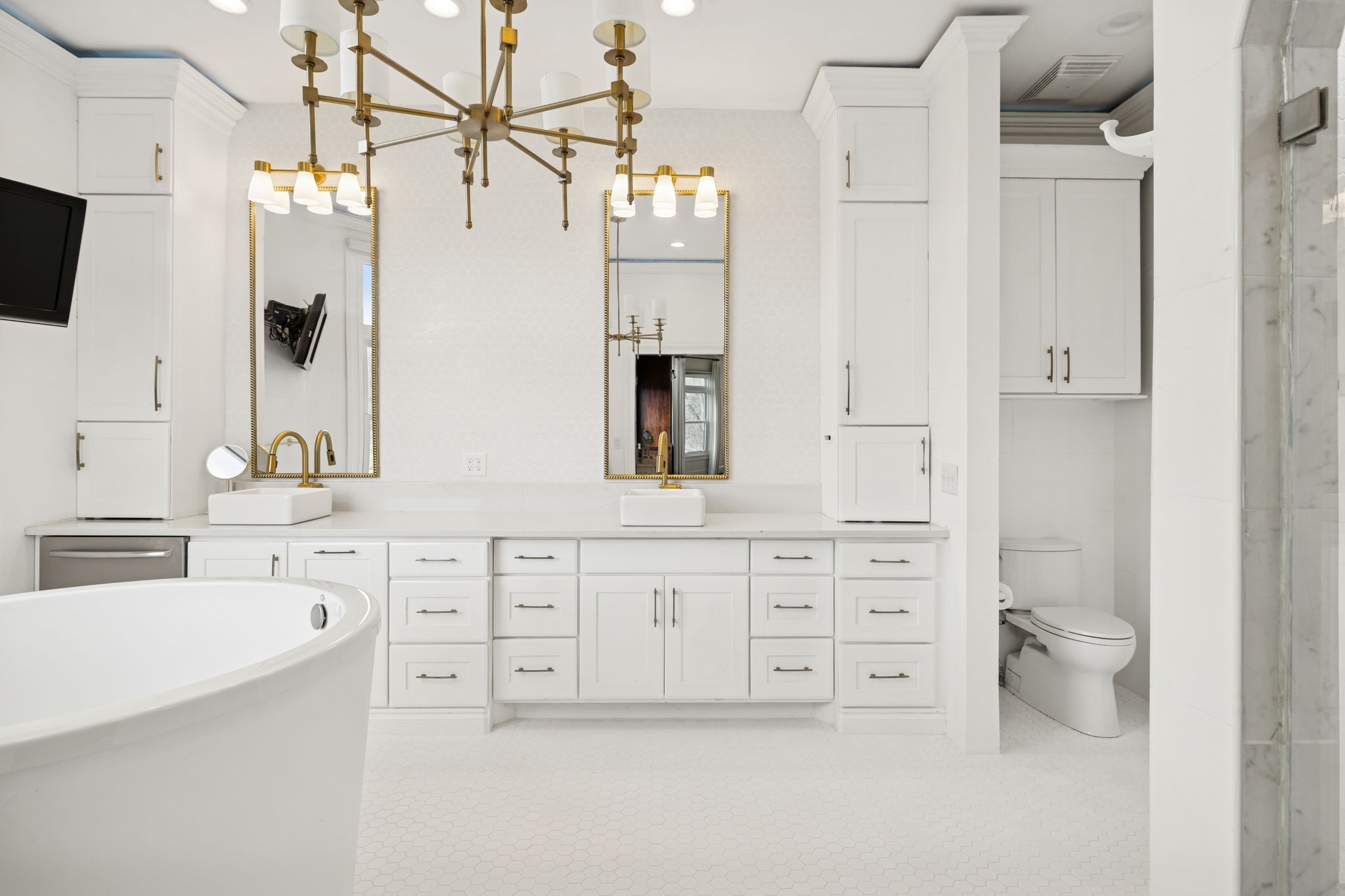 2194 South Berrys Chapel Road Franklin, TN 37069 - Photo 15 of 41 a bathroom with a double vanity sink a mirror a bathtub and shower