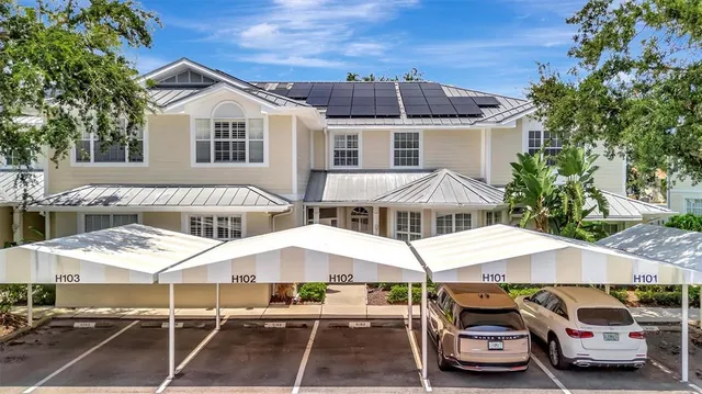 a car parked in front of white house
