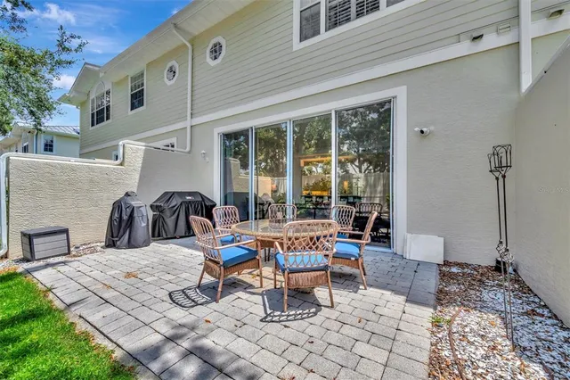 a spacious bedroom with a bed and a flat screen tv