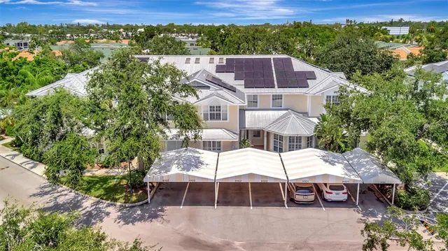 a view of a patio with table and chairs