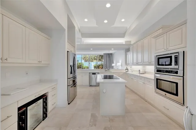 a kitchen with sink cabinets and microwave