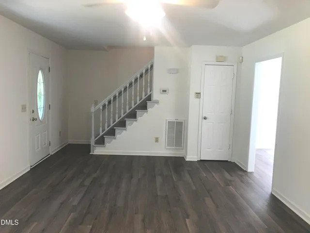 a view of entryway with wooden floor