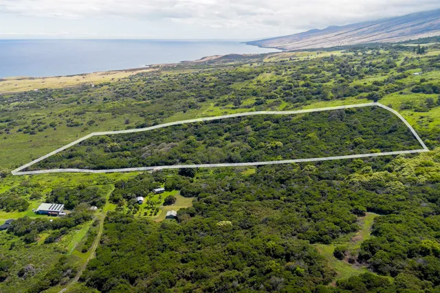 a view of a field with an outdoor space