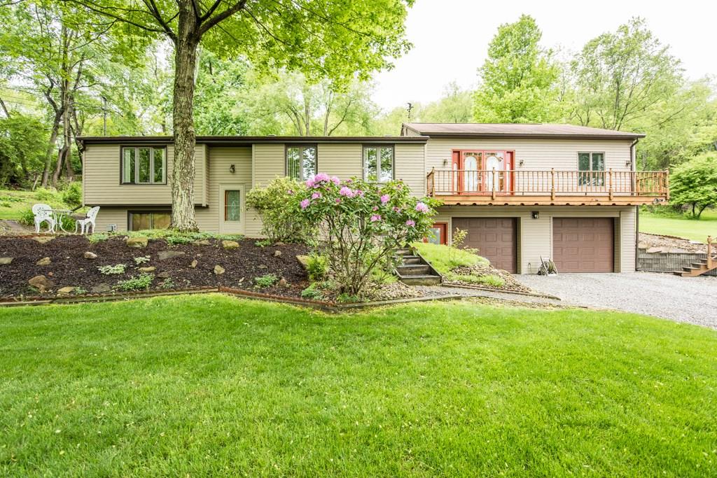 Welcome to this 3 bedroom/3 full bathroom private retreat located on over an acre in Marshall Township.
