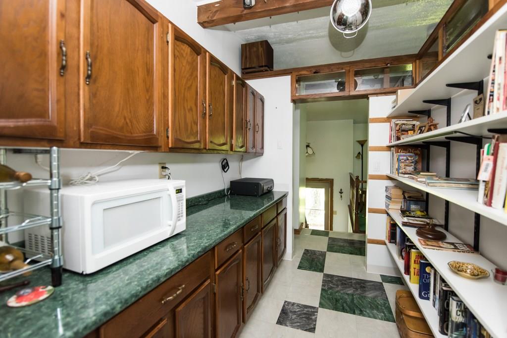 The butler's pantry is located right off of the kitchen and is great for a library area and/or pantry.
