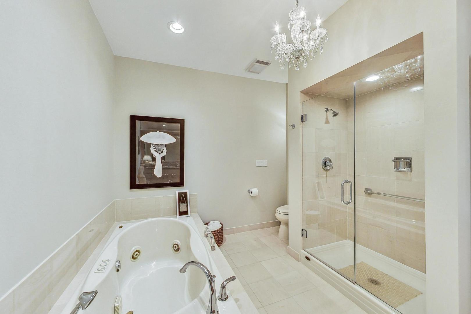 209 Rivershire Lane, Unit 503 Lincolnshire, IL 60069 - Photo 26 of 53 a bathroom with a sink a toilet and shower