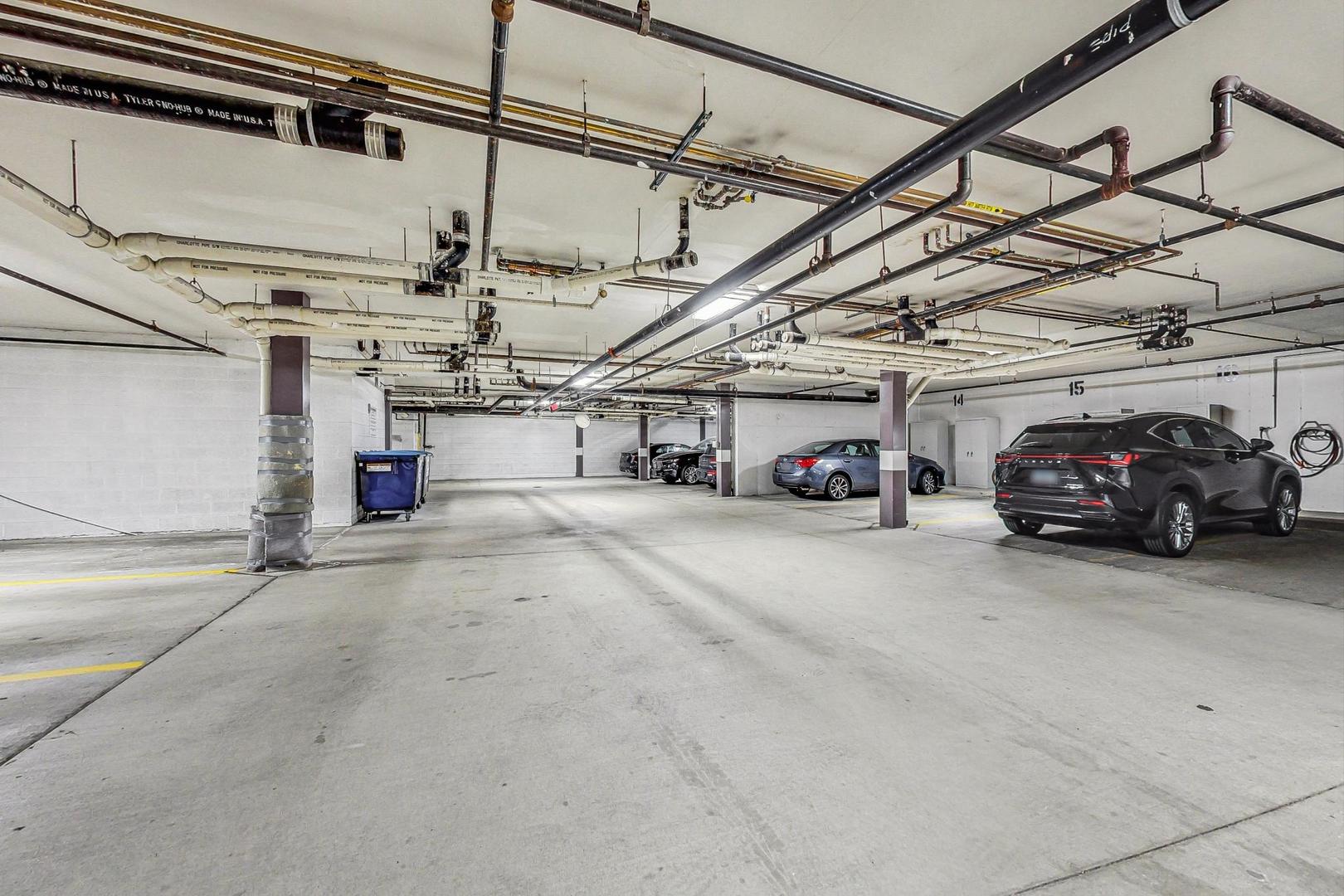 209 Rivershire Lane, Unit 503 Lincolnshire, IL 60069 - Photo 49 of 53 a view of parking garage with cars