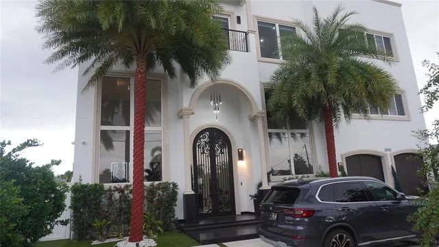 a kitchen with stainless steel appliances granite countertop a sink a stove and a wooden cabinets