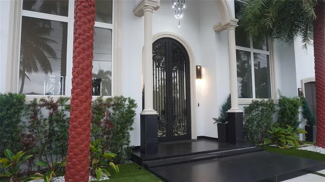 a kitchen with a sink a stove and chairs