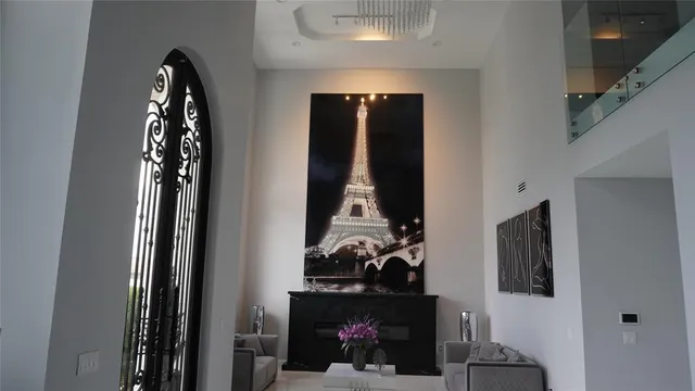 a kitchen with kitchen island a counter top space cabinets and stainless steel appliances