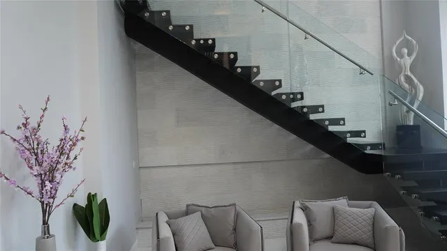 a view of a room with workspace and windows