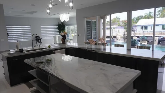 a view of a patio with dining table and chairs with a fountain
