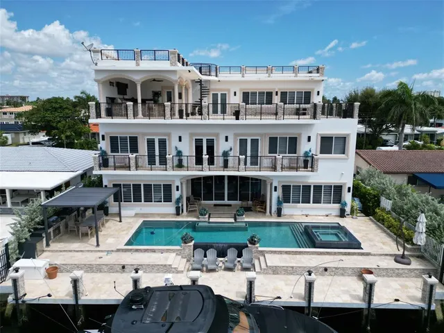 an aerial view of residential houses with outdoor space and street view
