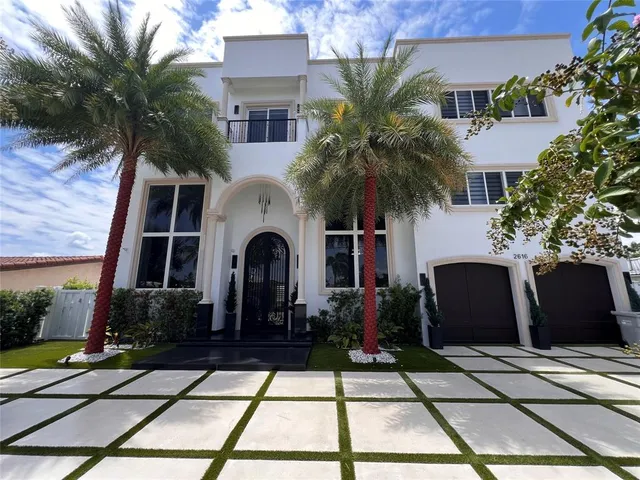 an aerial view of a house with a ocean view