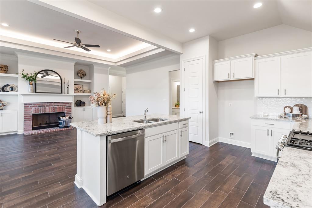 331 Prien Lk Loop Bossier City, LA 71111 - Photo 15 of 37 Kitchen with light stone counters, white cabinets, and recessed lighting